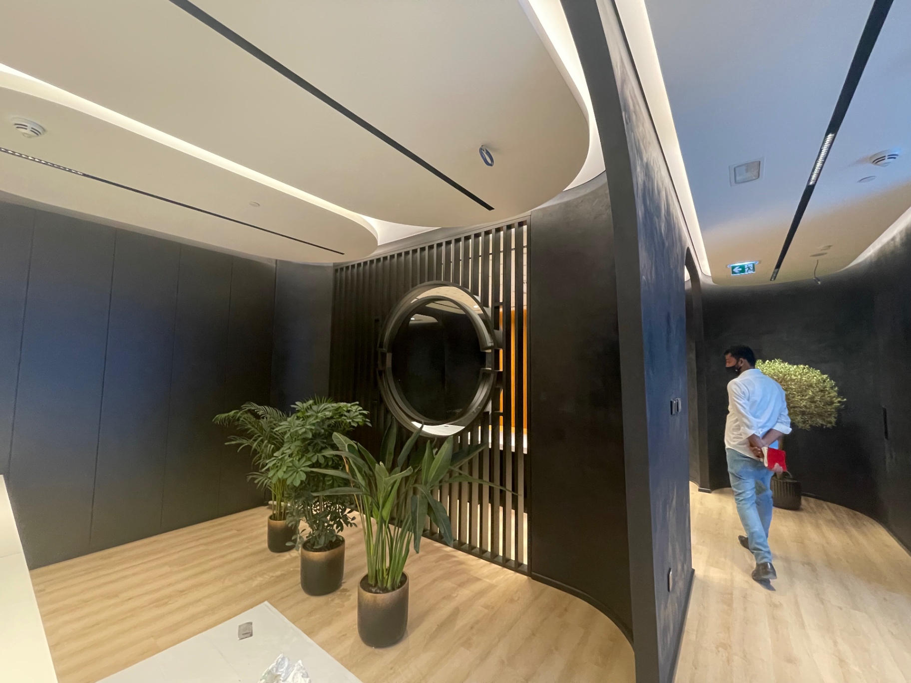 Reception lobby with slatted screen & planting — complete fit-out execution and handover by Ab & Zen Interior