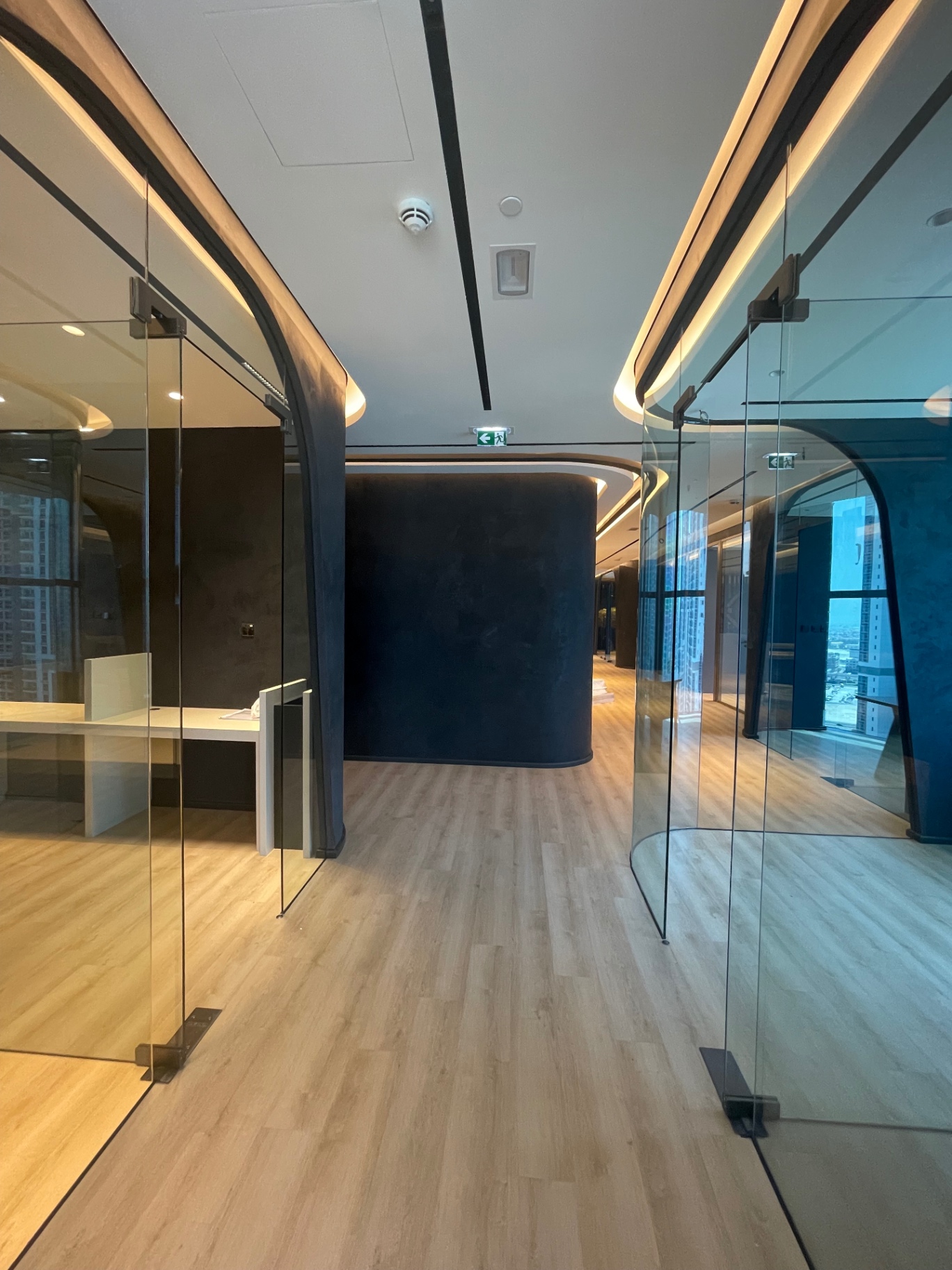 Curved glass partitions & sculpted ceiling coves — complete fit-out execution and handover by Ab & Zen Interior