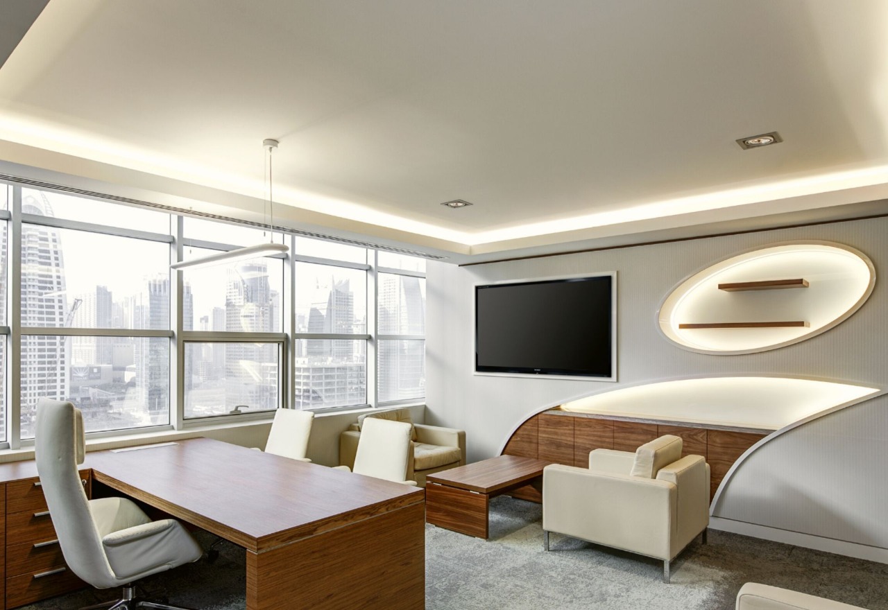 Executive office with curved backlit joinery — commercial interior design by Ab & Zen Interior