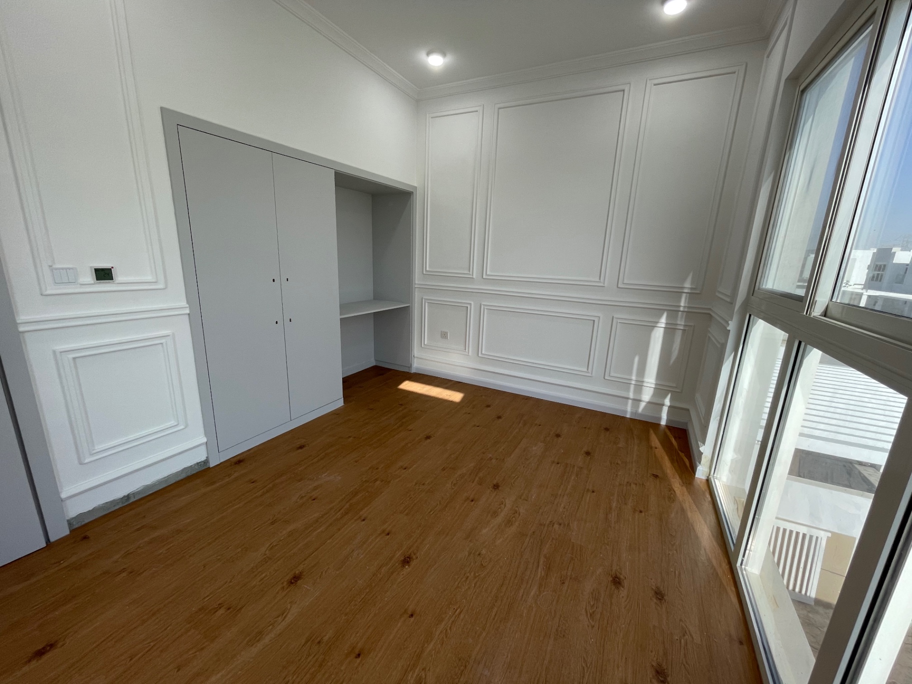 Bedroom with fitted wardrobe and study niche — residential renovation in the Netherlands by Ab & Zen Interior