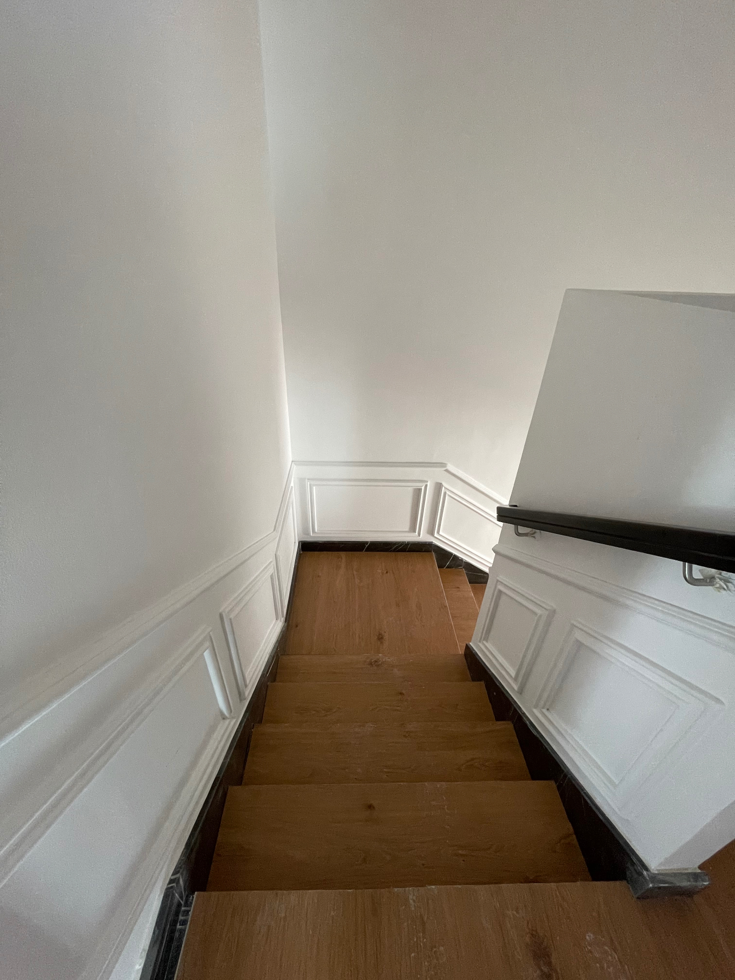Landing detail — moulding, marble skirting & oak treads — residential renovation in the Netherlands by Ab & Zen Interior