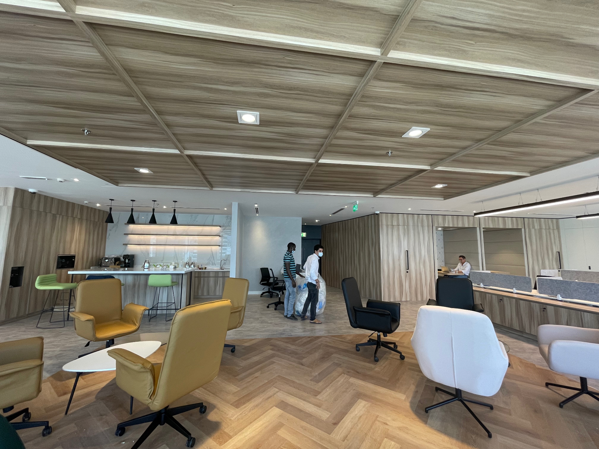 Café-style pantry counter & informal meeting zone — corporate office delivered from design to execution by Ab & Zen Interior